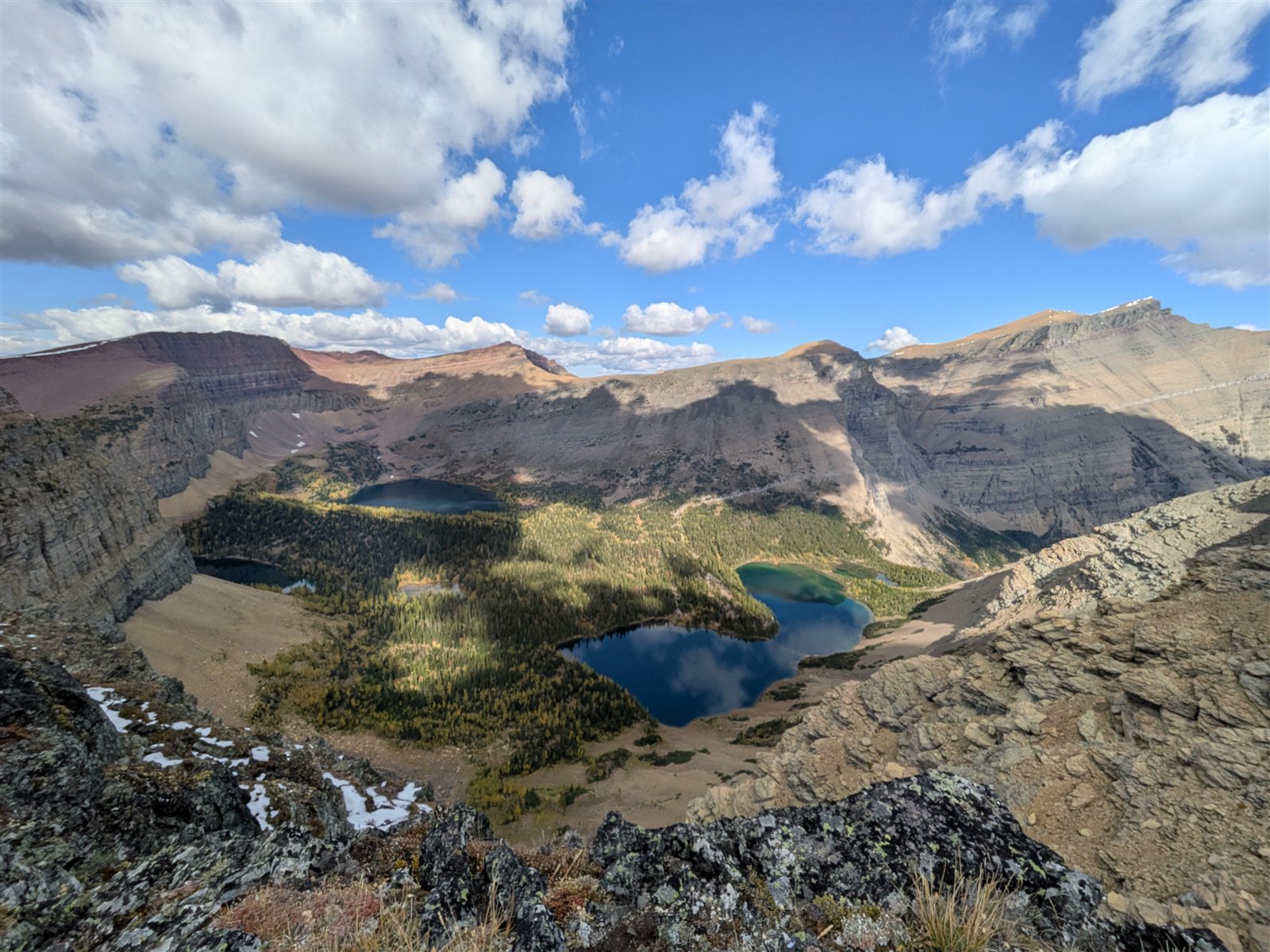 Blue Lineham Lakes in a rocky basin far below the viewpoint